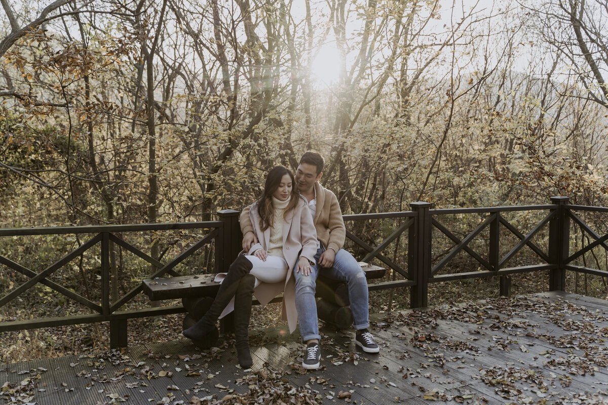 the couple sitting on the bench of the eco park in damyang