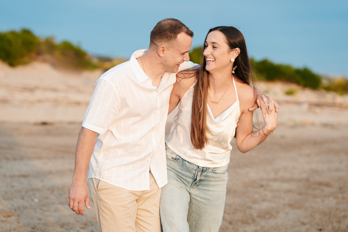 Candid ocean engagement portraits in New England with relaxed emotional storytelling