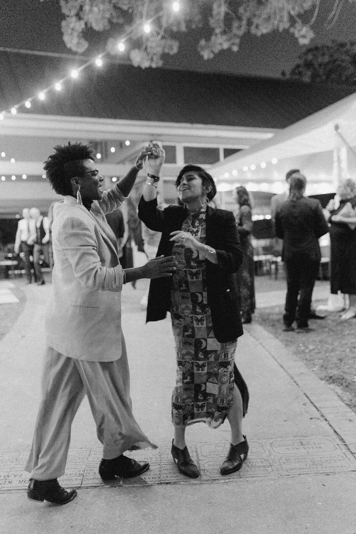 Guests dancing at wedding reception at Umlauf Sculpture Garden, Austin
