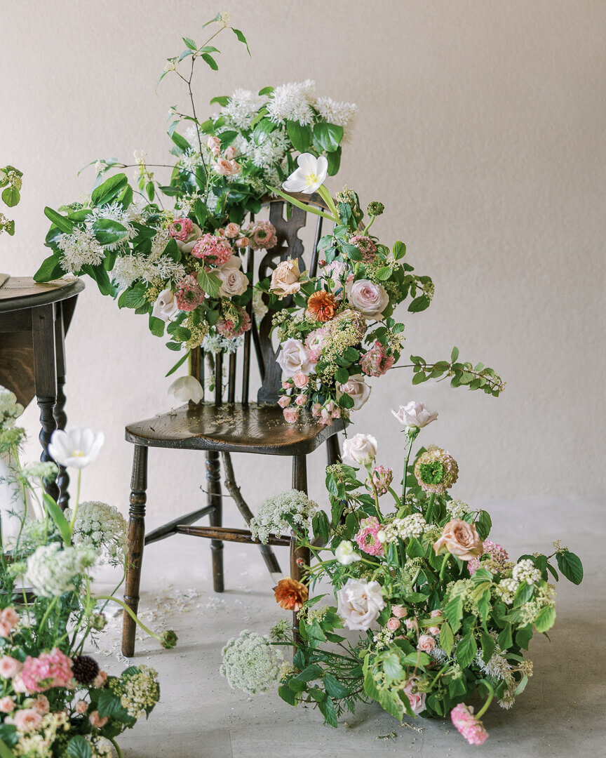 vintage floral chair florist bridal session with butterfly ranunculus and fringe tree