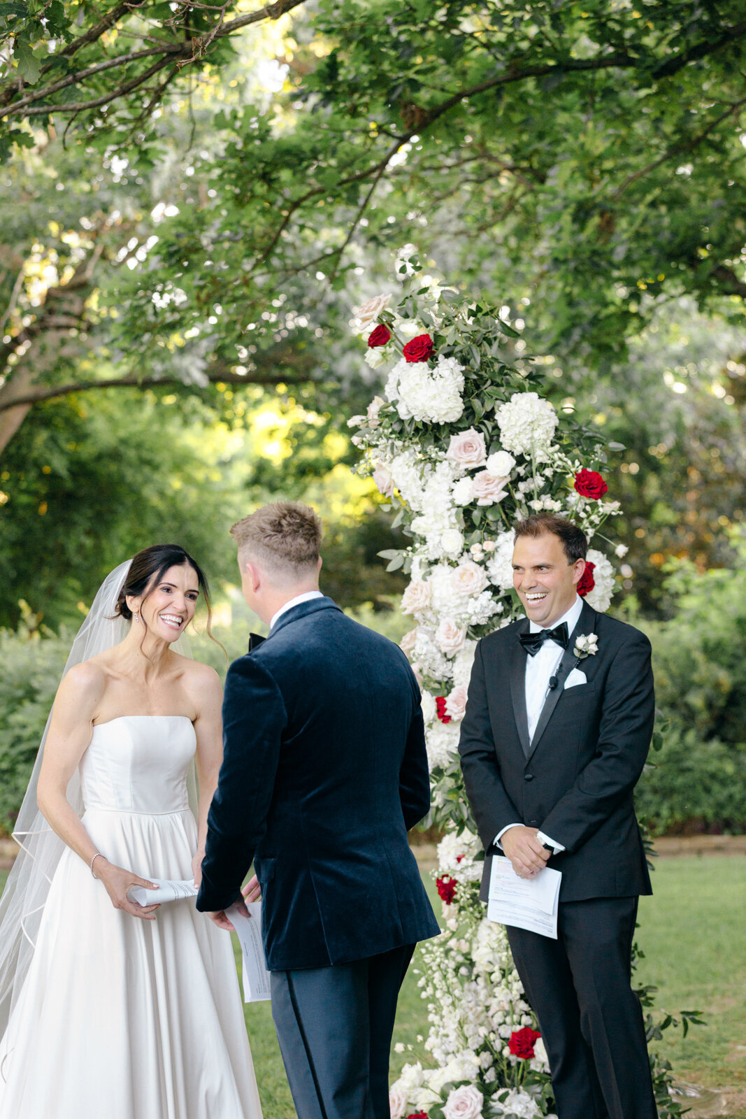 Candid moment during a wedding ceremony at the Dallas Arboretum.