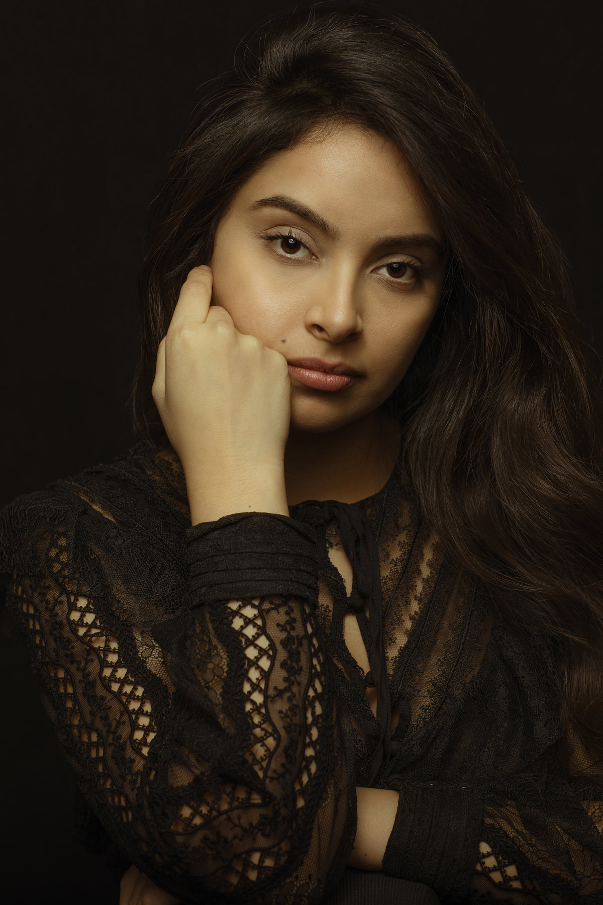 Portrait Photo Of Young Woman With Her Hand On Her Face Los Angeles