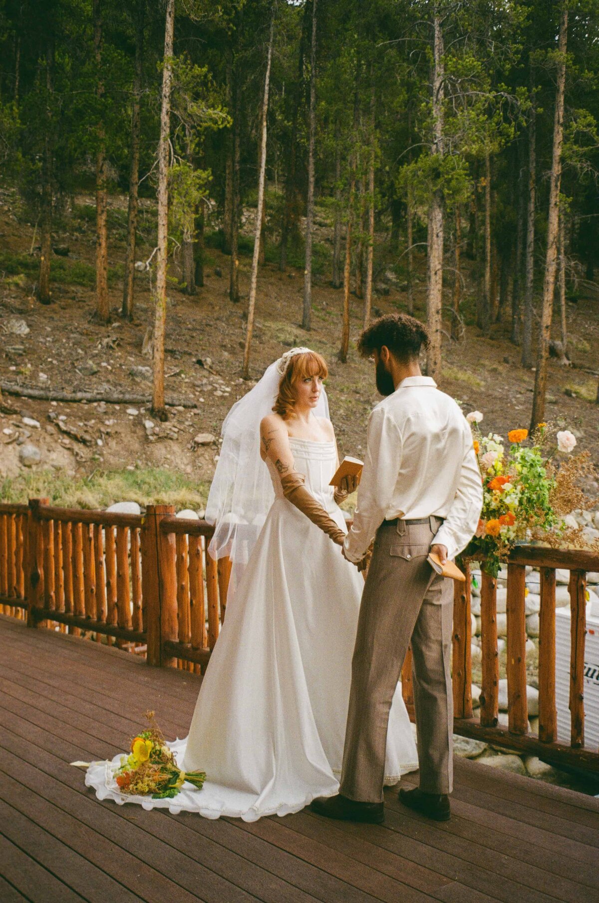 A bride says her vows to her groom at a private cabin in Leadville, Colorado.