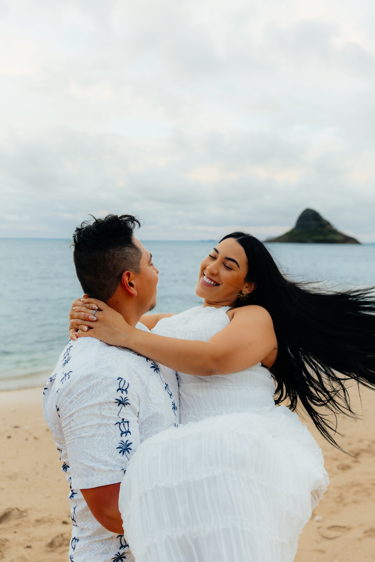 Romantic and candid true to color couples photography at Kualoa Beach on Oahu