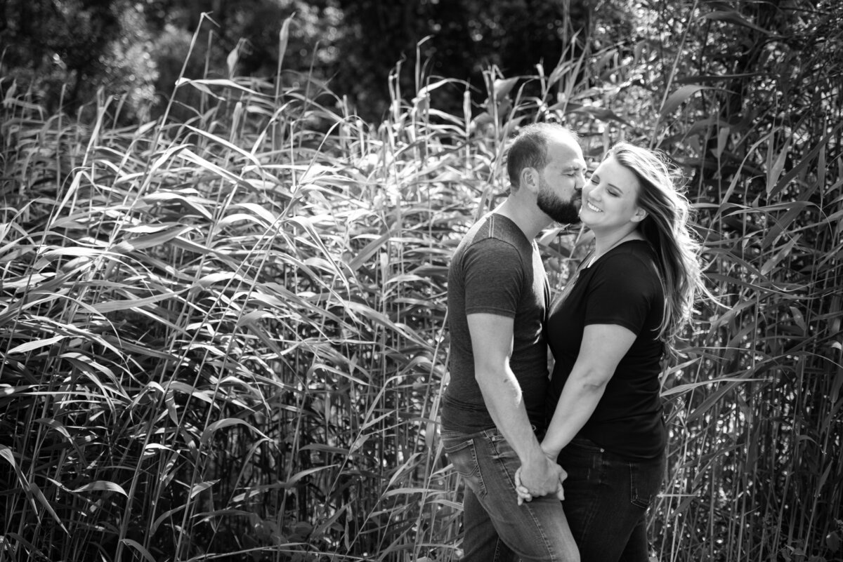 engagement_photo_in_tall_grass_black_and_white