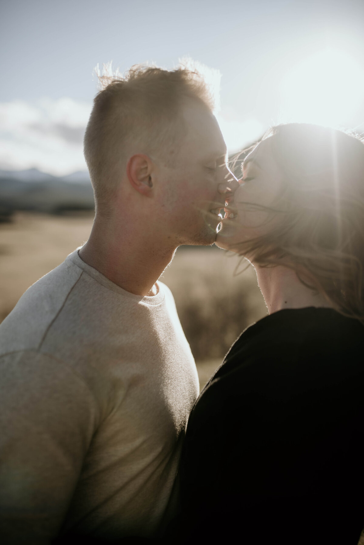 man and woman share a kiss