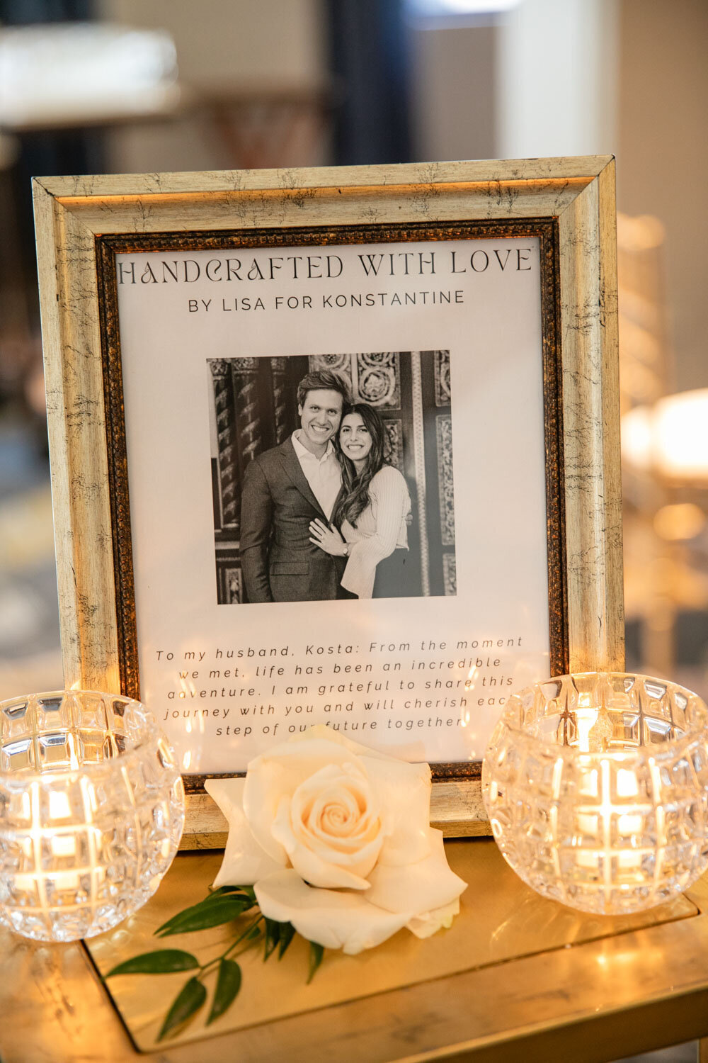 A framed picture of a man and woman says handcrafted with love