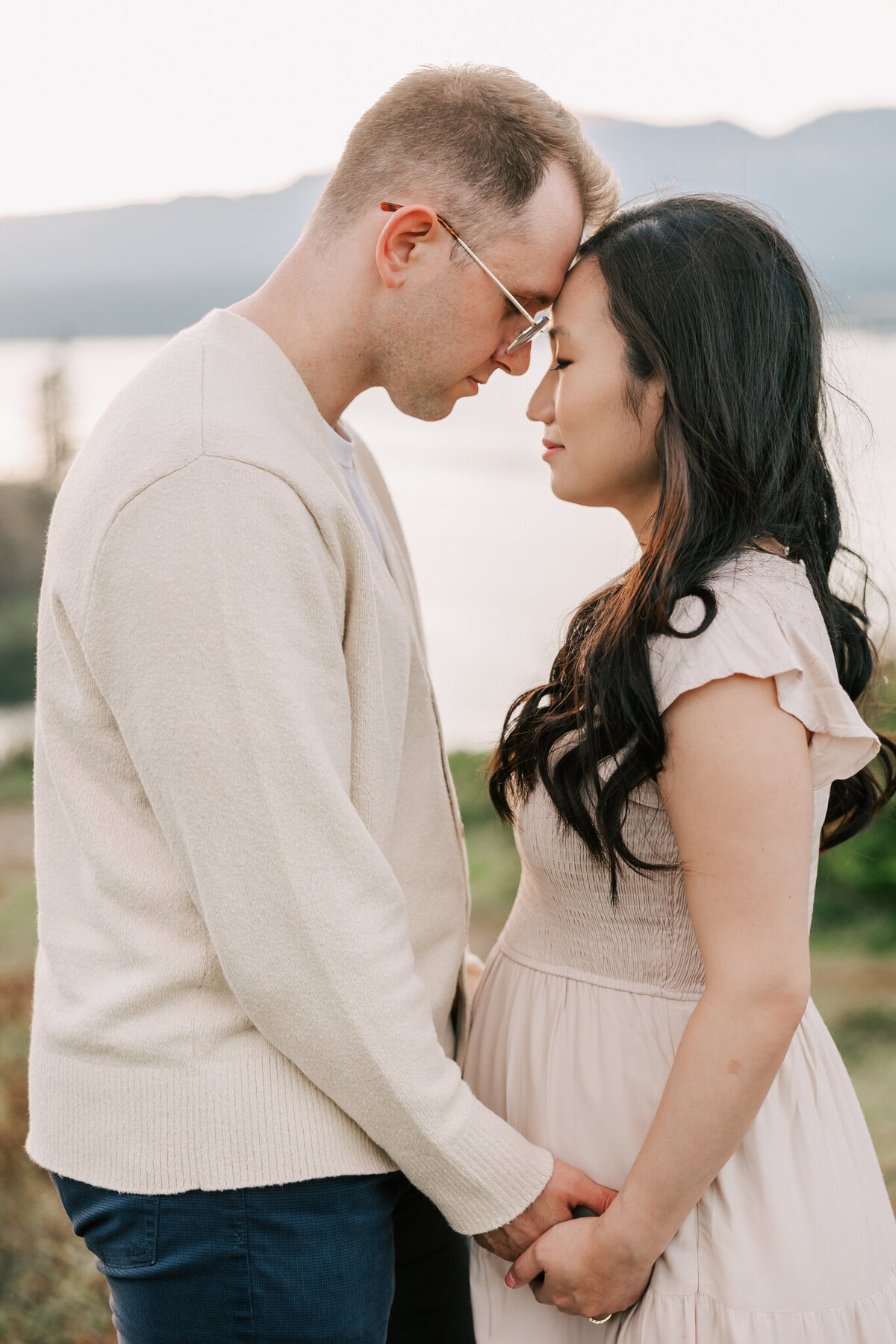 sweet portrait of a couple looking at each other and leaning body together