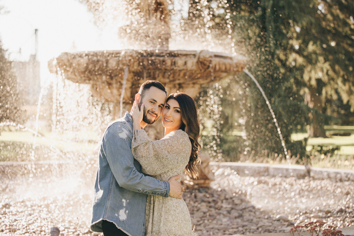 Couple posing for photos at their Elm Hurst Engagement Session by NovaMarkina Photography