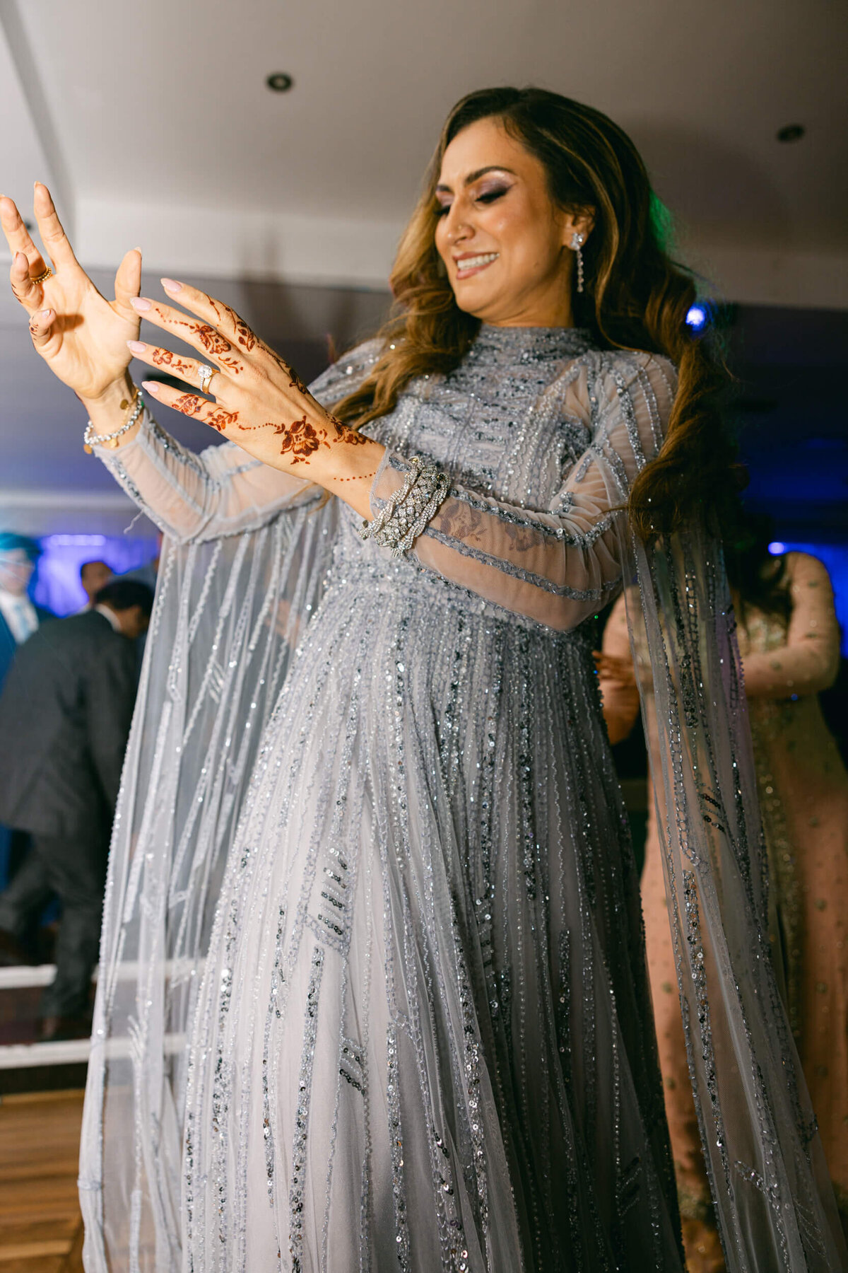 A wedding photo of a bridesmaid dancing during the wedding reception in Dublin Ireland
