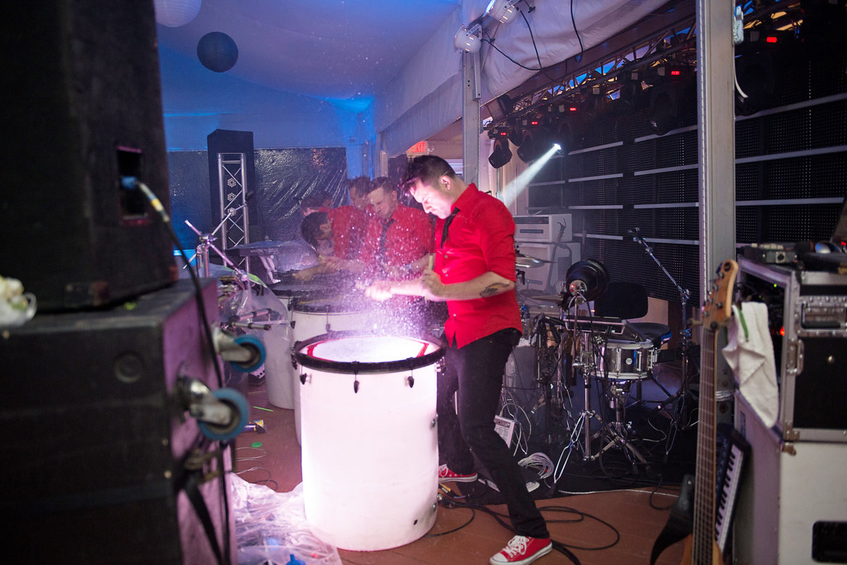 Band on drums with water at a wedding at Oceanbleu