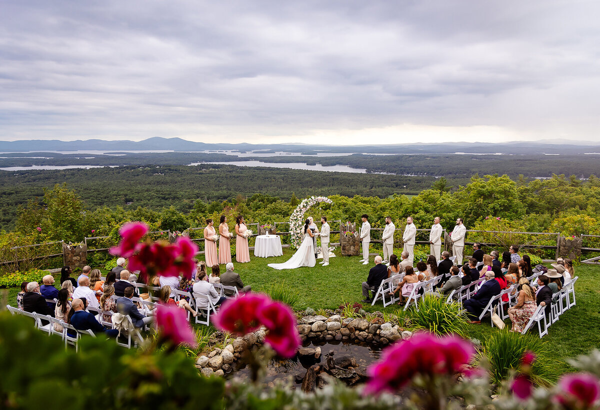 Wedding ceremony overlooking lake winnipesaukee at Castle in the Clouds wedding venue