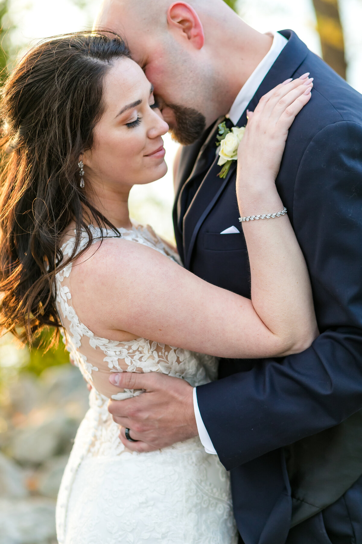 cargill room waterfront wedding la crosse wisconsin photographer bride and groom holding each other