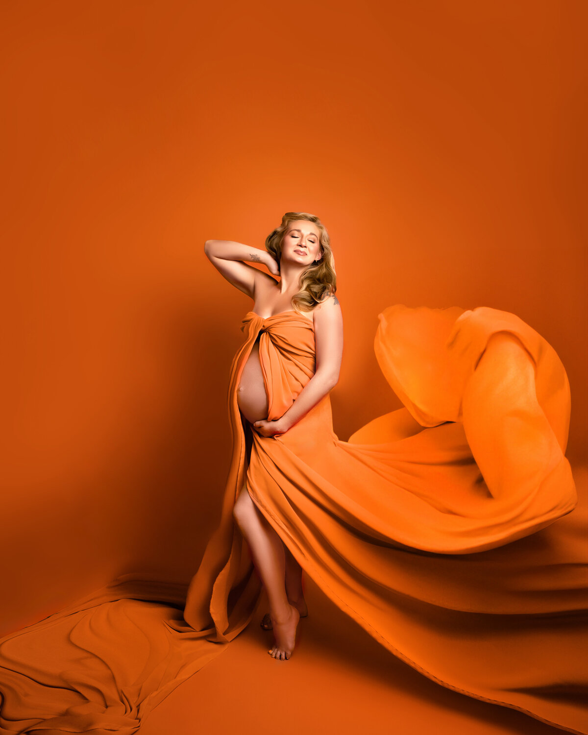 orange flow fabric pregnant belly maternity woman blonde