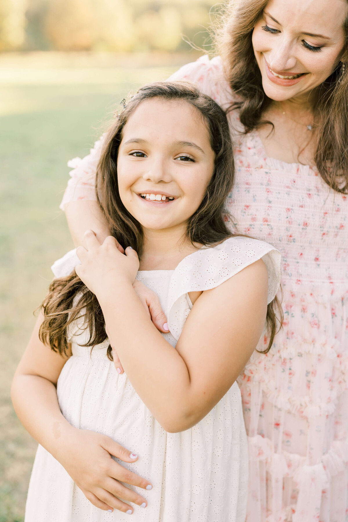 a mom and daughter embracing