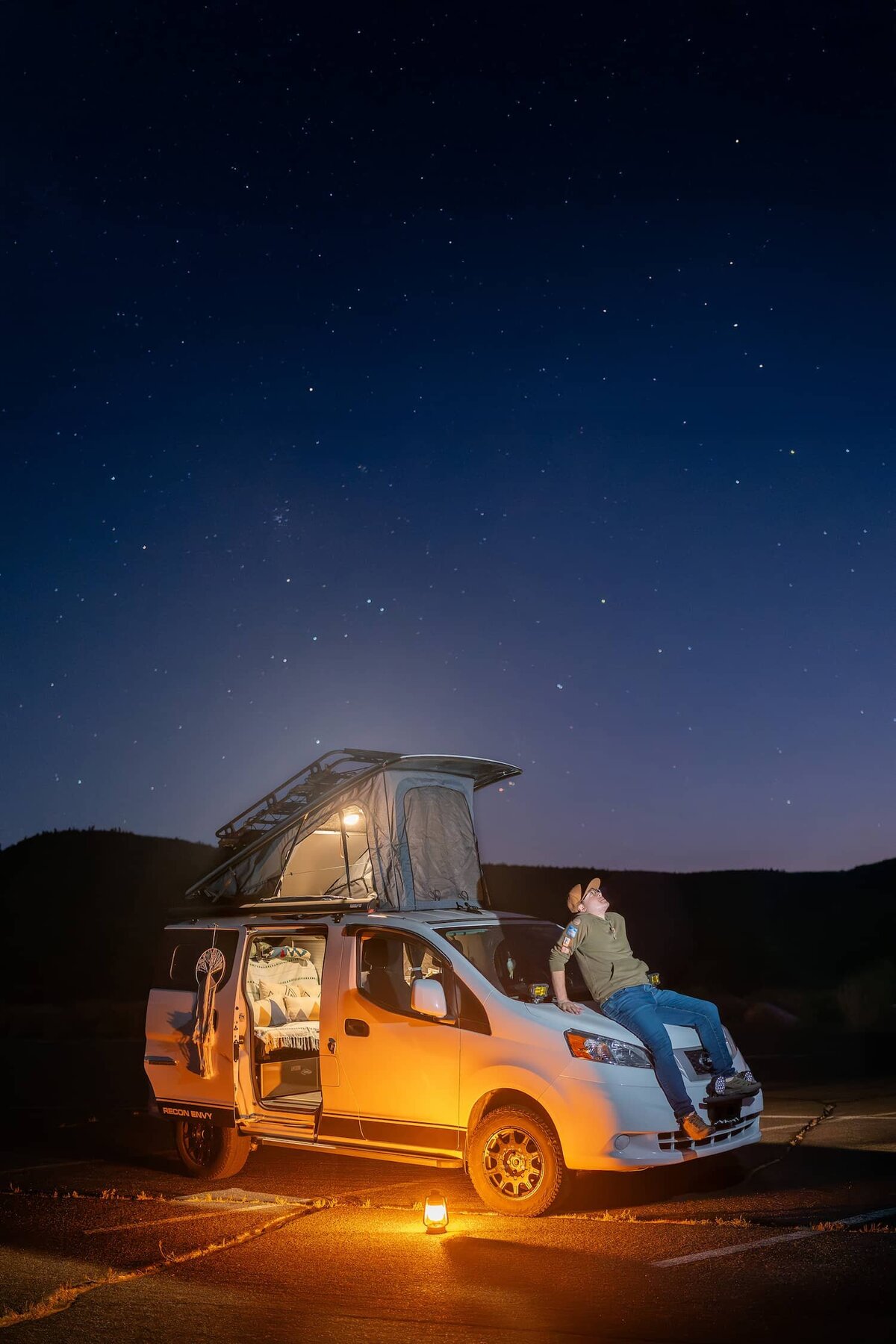 Peter 3 Photography, a Joshua Tree and Yosemite Elopement Photographer stargazing at night in his camper van.