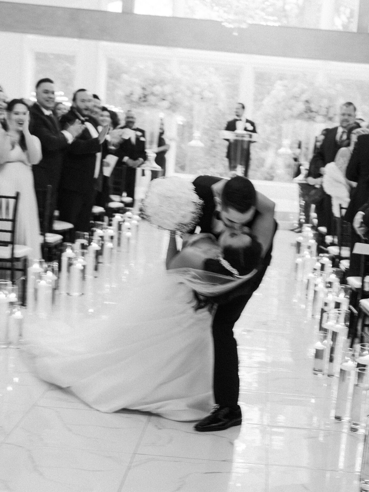 sandlewood manor luxury modern wedding bride groom kiss down aisle