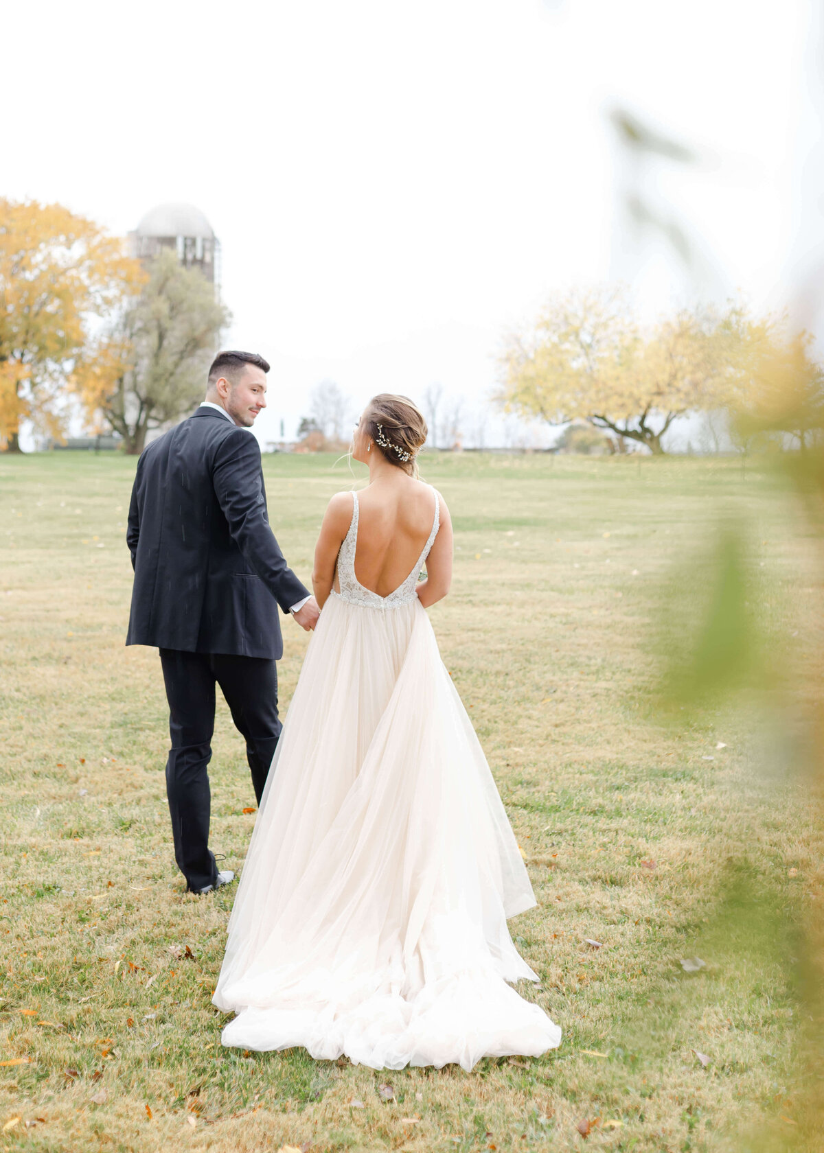 hand in hand bride and groom