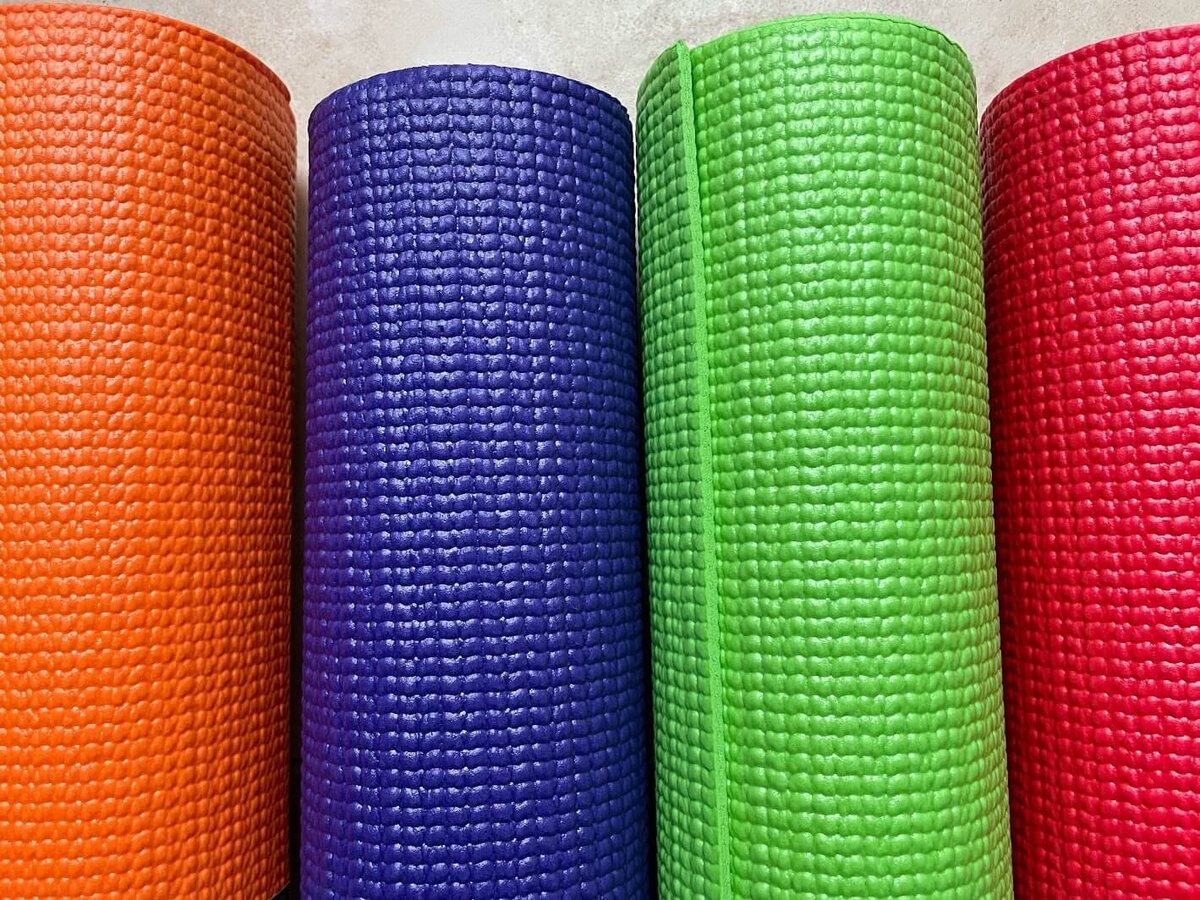 colorful rolled up yoga mats