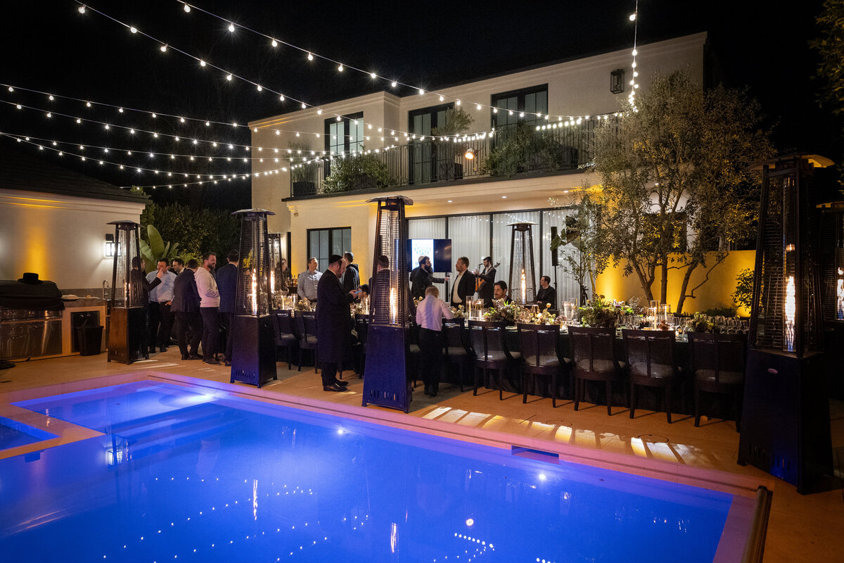 view of the pool and bistro lights