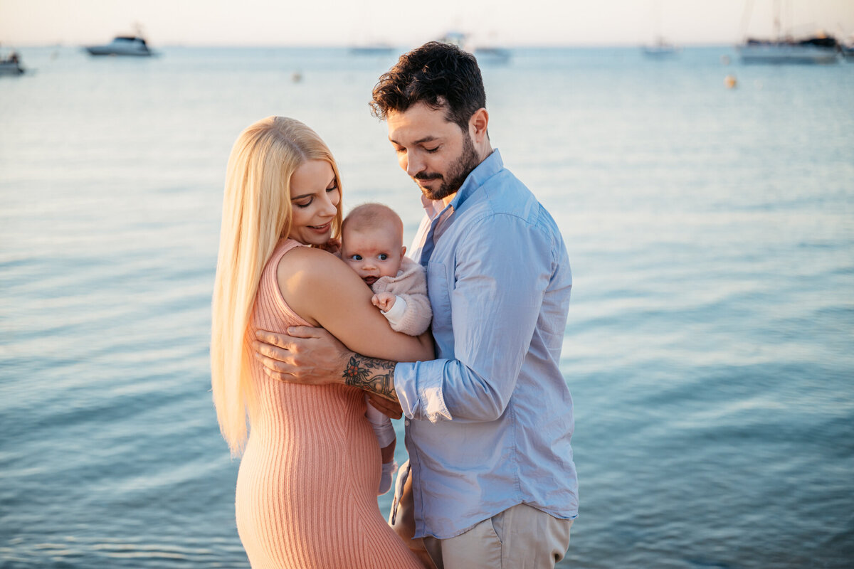 Family of three at their beach photoshoot
