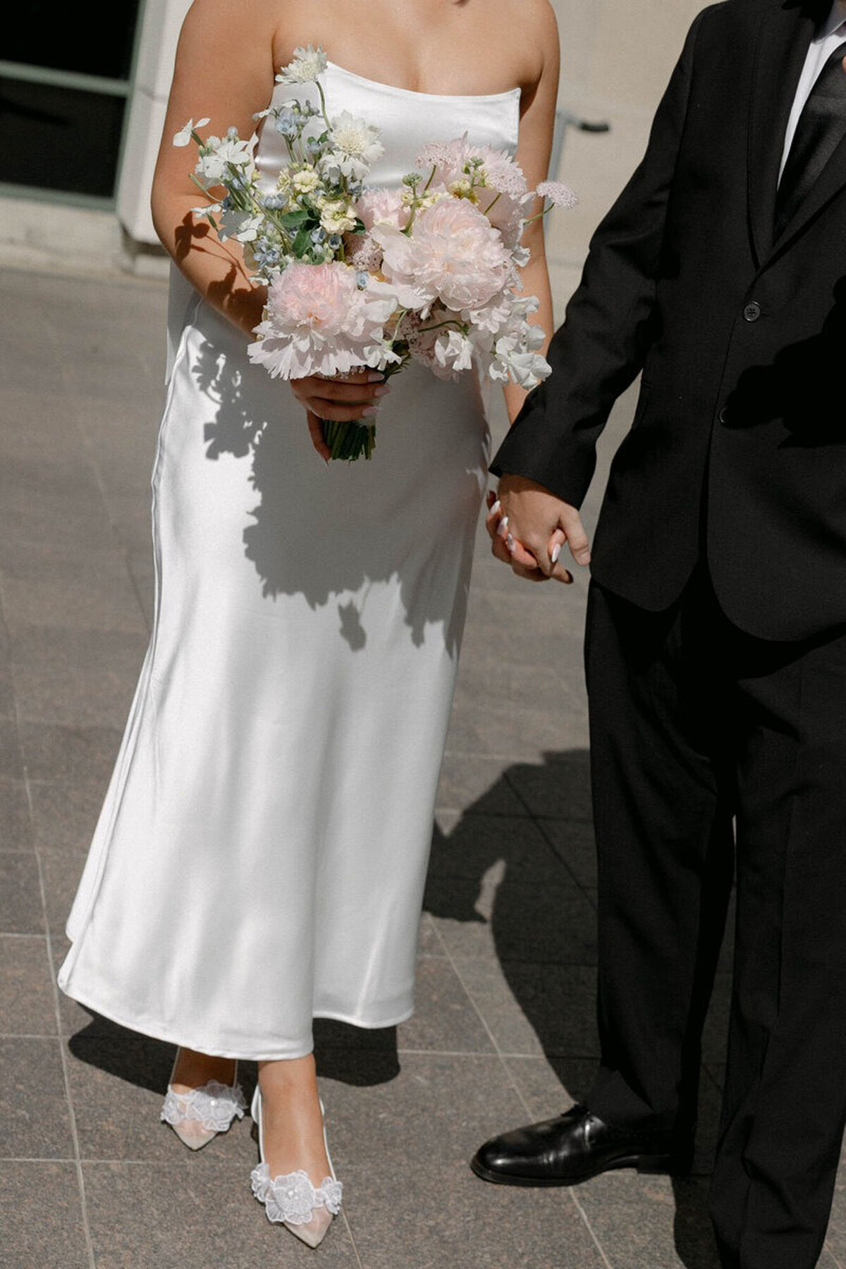 Bride and groom holding hands by Marissa Nicole, one of the best photographers in orlando fl