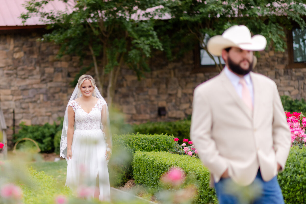 bride walking up to her groom before their wedding ceremony for an outdoor first look