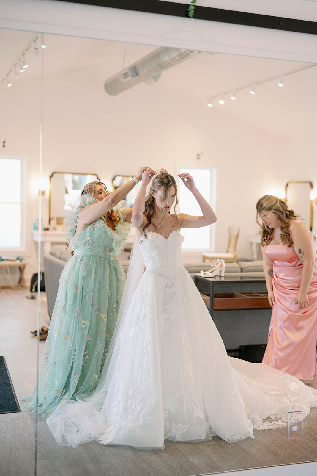 Bride’s mother placing her veil before the ceremony during bridal prep at The Ivy House.