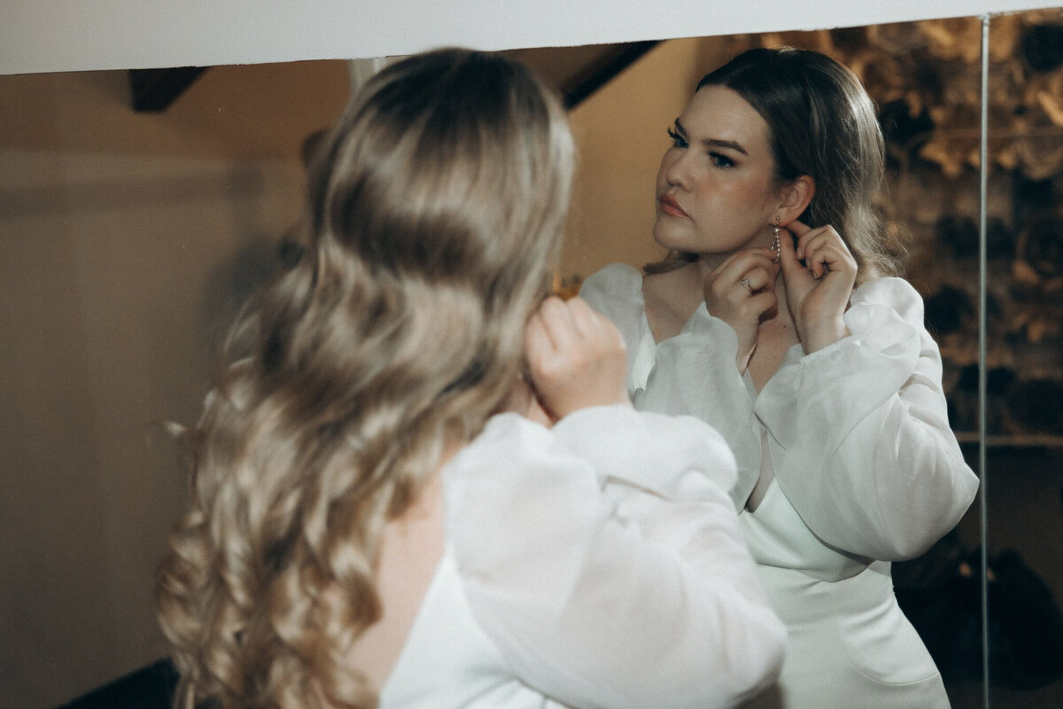 Bride getting ready for wedding day by Victoria Pattemore, adventurous and authentic wedding photographer in Calgary, Alberta. Featured on the Bronte Bride Vendor Guide.