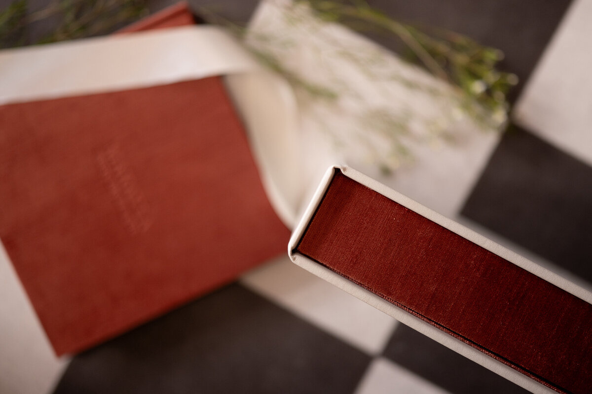 Details of the red and white binding on an heirloom photo album