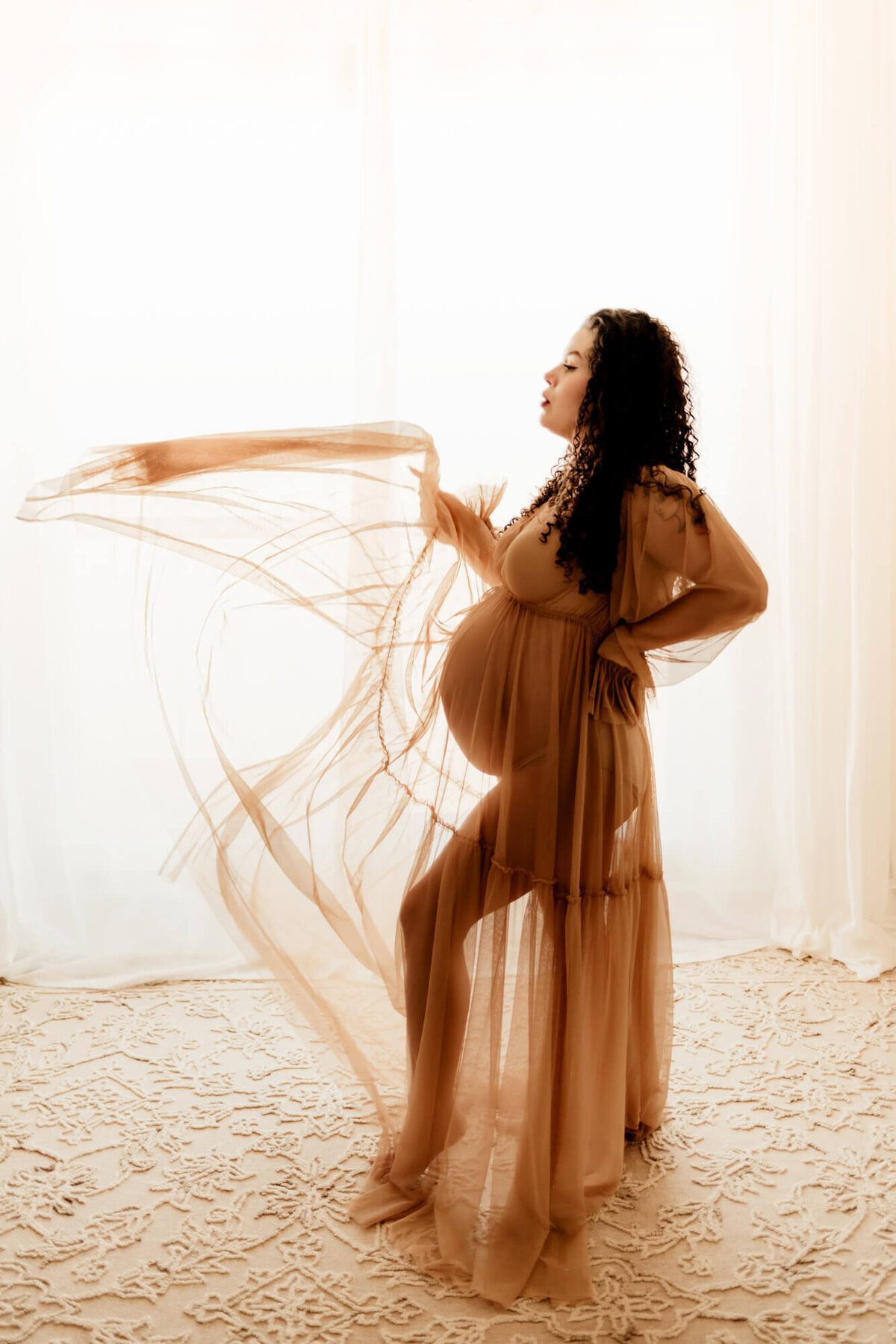 Pregnant woman swishes her dress into the air, Mustang Oklahoma.