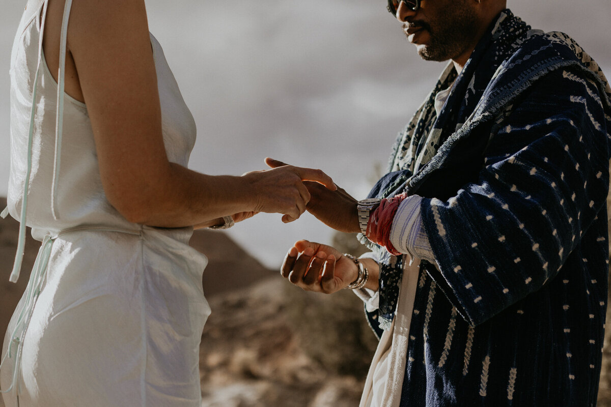 bride and groom exchanging rings during their elopement ceremony