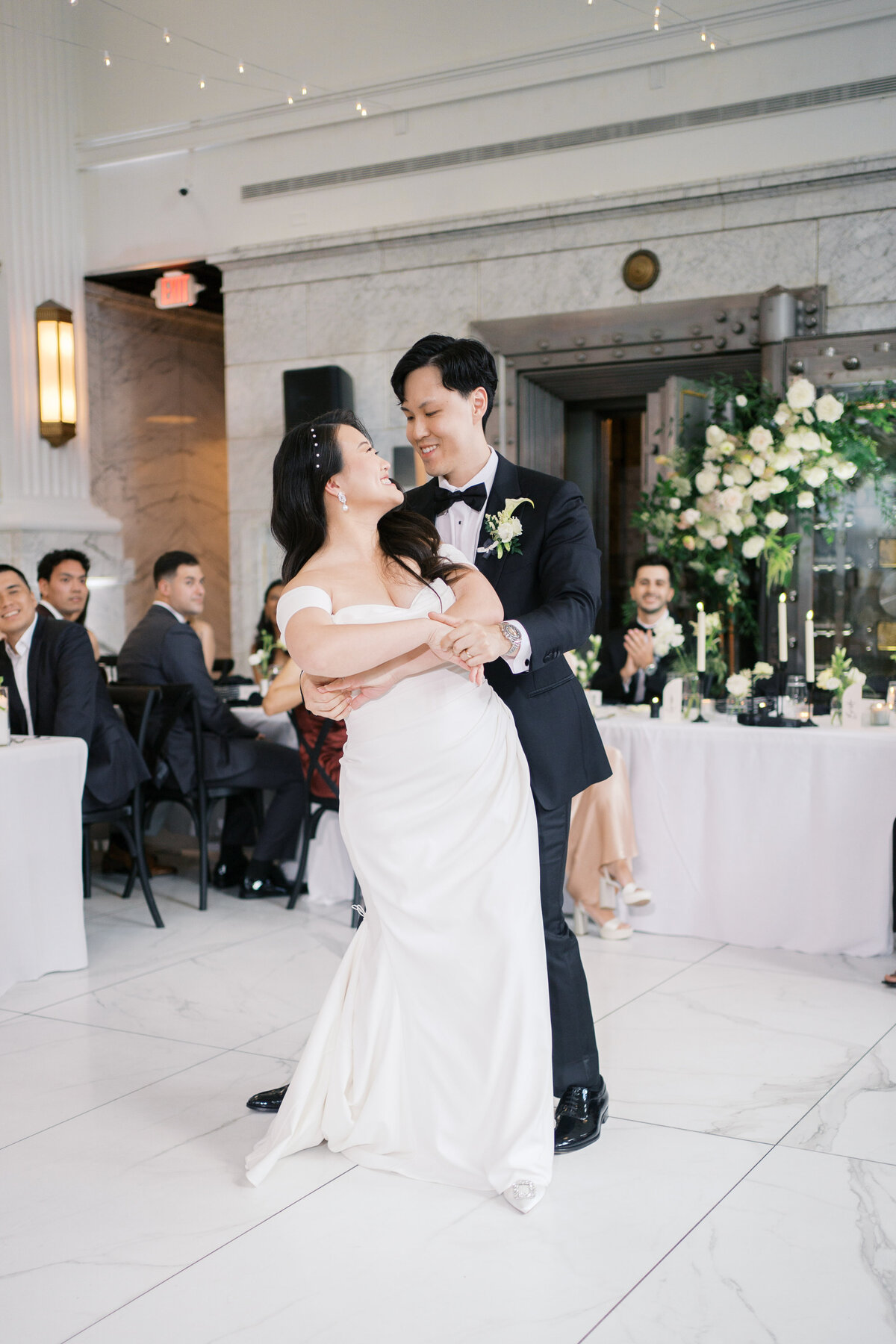 Groom dipping bride during wedding first dance