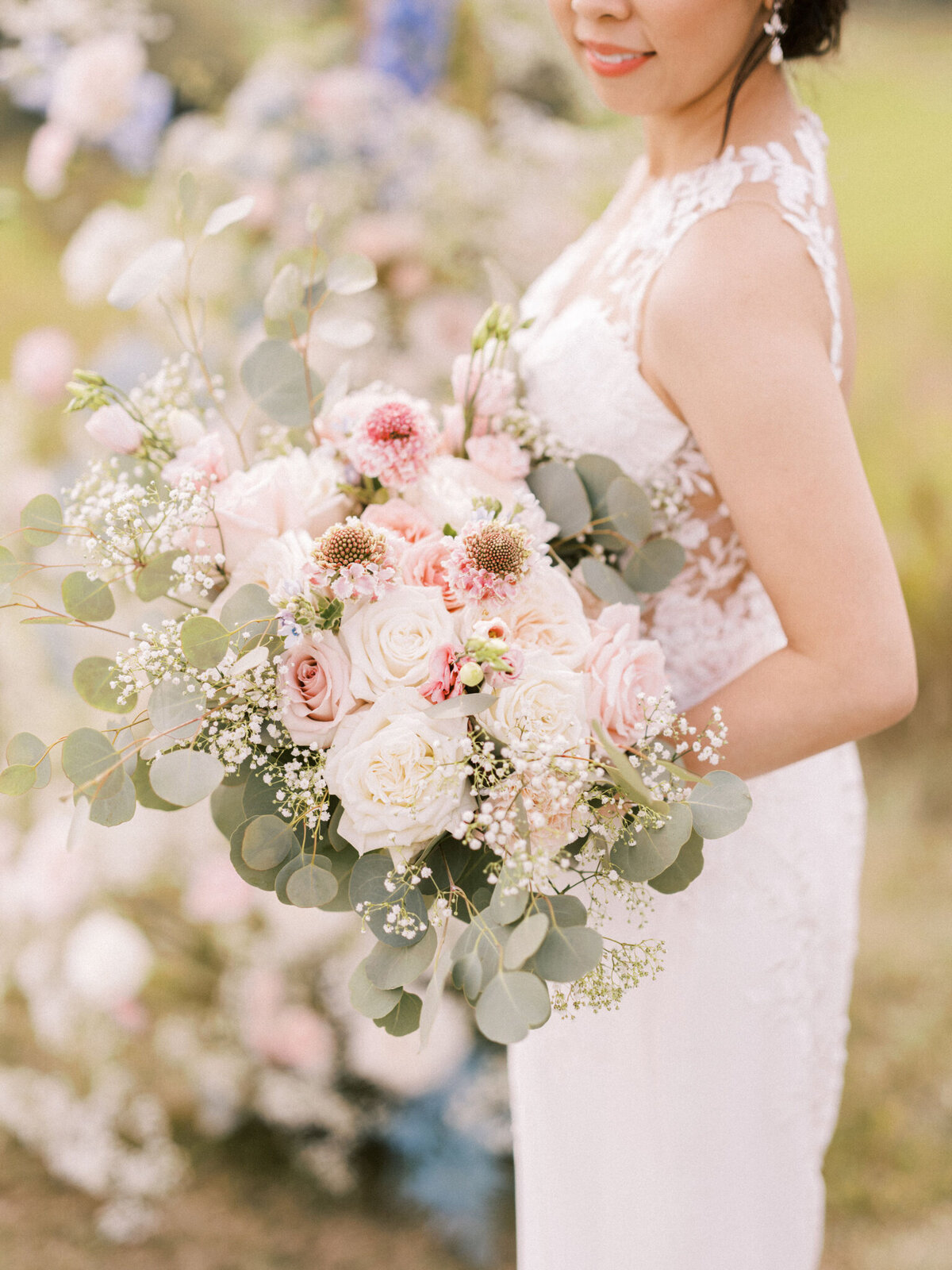 Classic bouquet with white and pink roses by Flower Aura By Natasha, classic Calgary, Alberta wedding florist, featured on the Brontë Bride Vendor Guide.