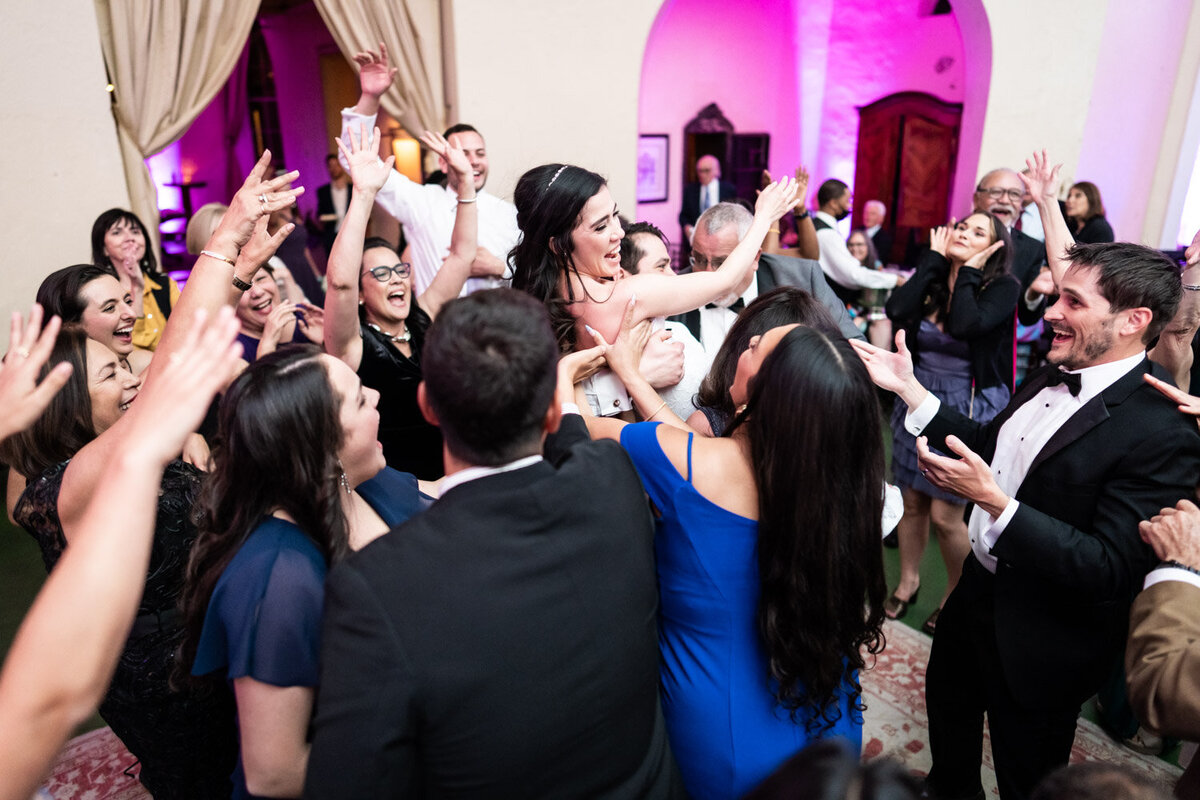 Guests lift bride during wedding reception at Latrobe's