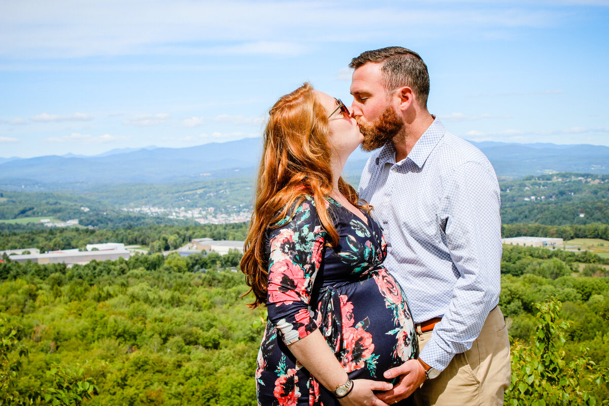 New England maternity photography session with couple kissing