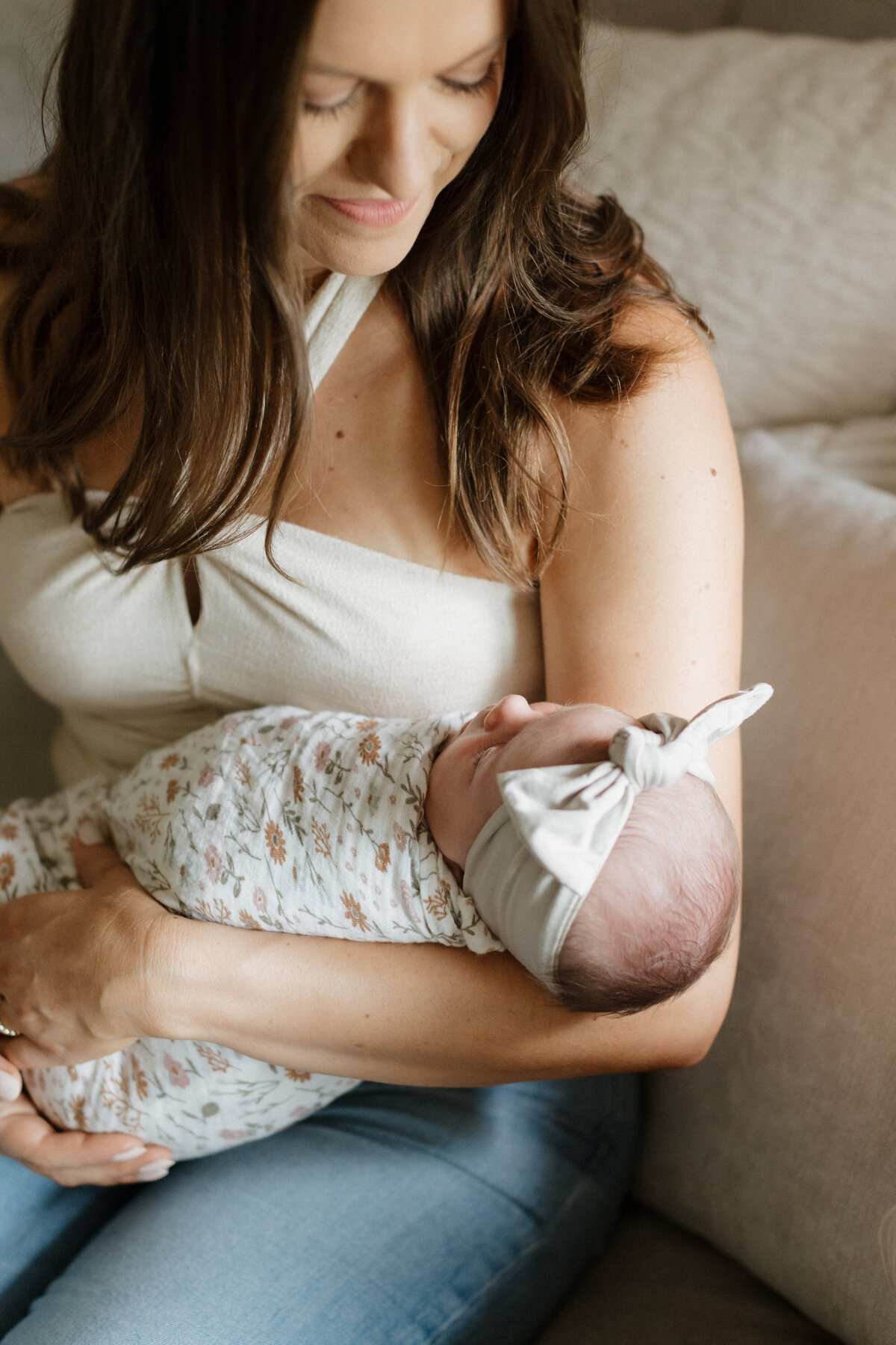 Indianapolis family photographer mother holding newborn