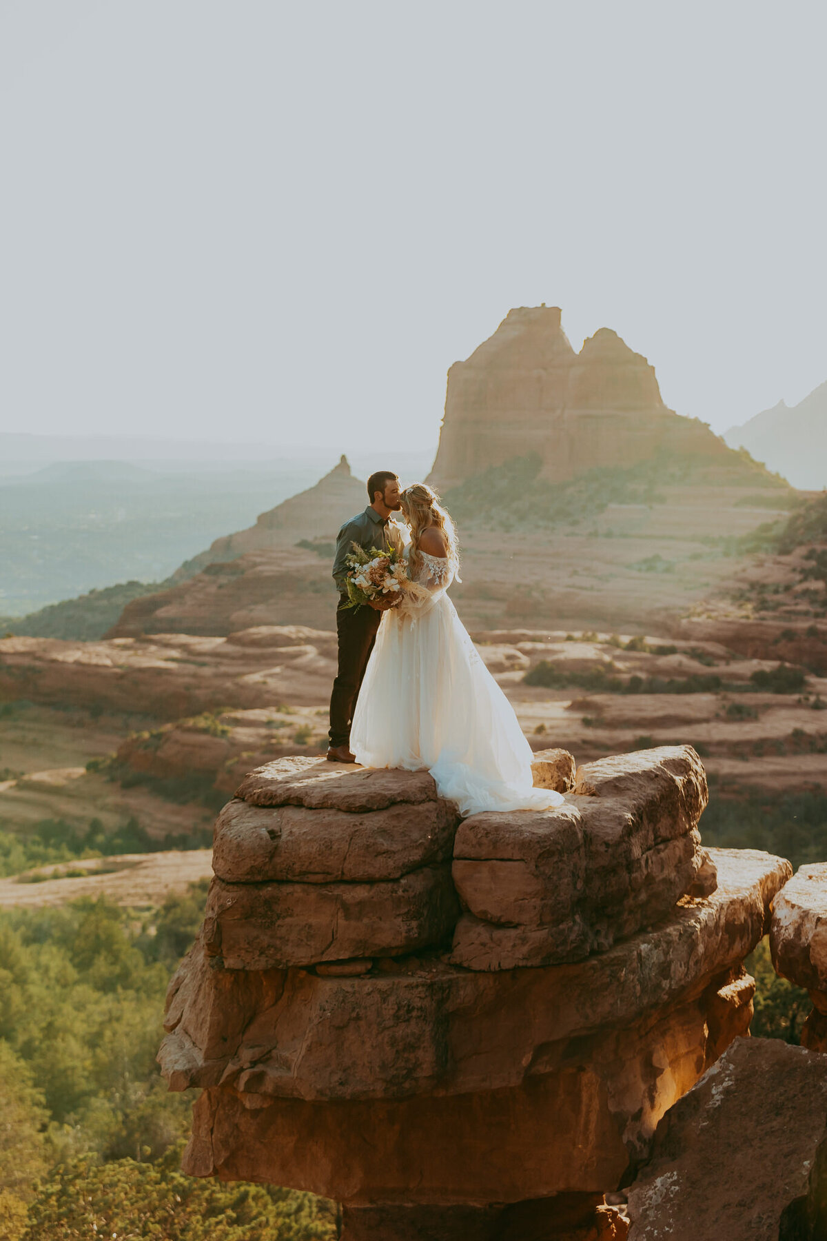 magical sedona couple on red rocks