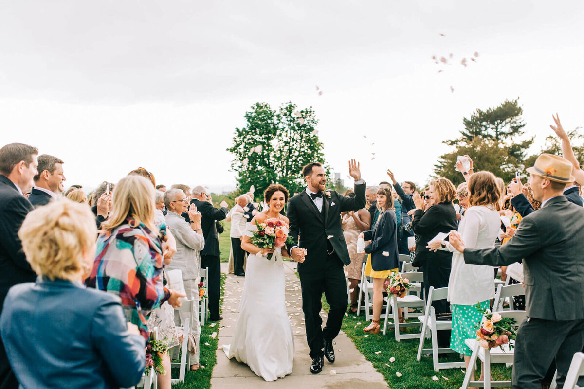 couple walking down aisle at ceremony