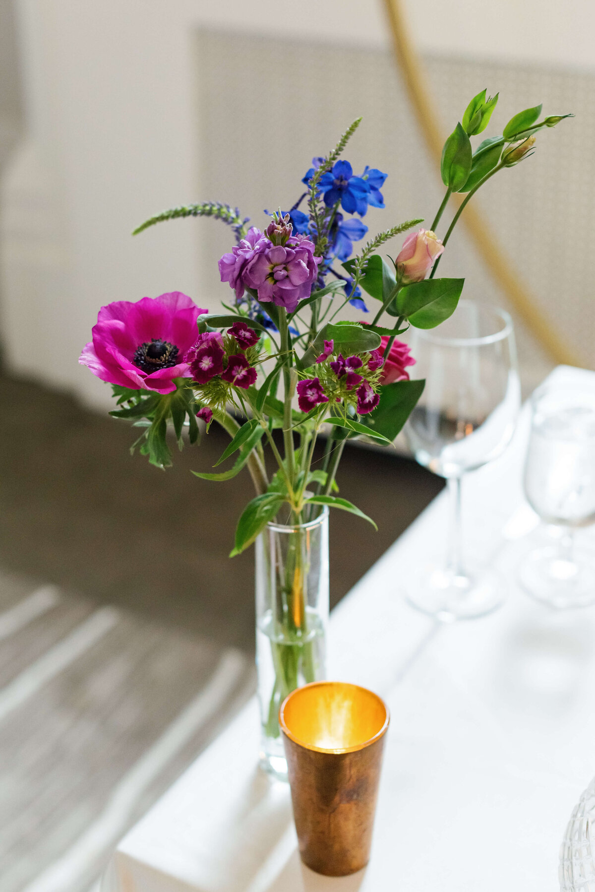 Candle and colorful florals at  at Halifax Club wedding in Nova Scotia