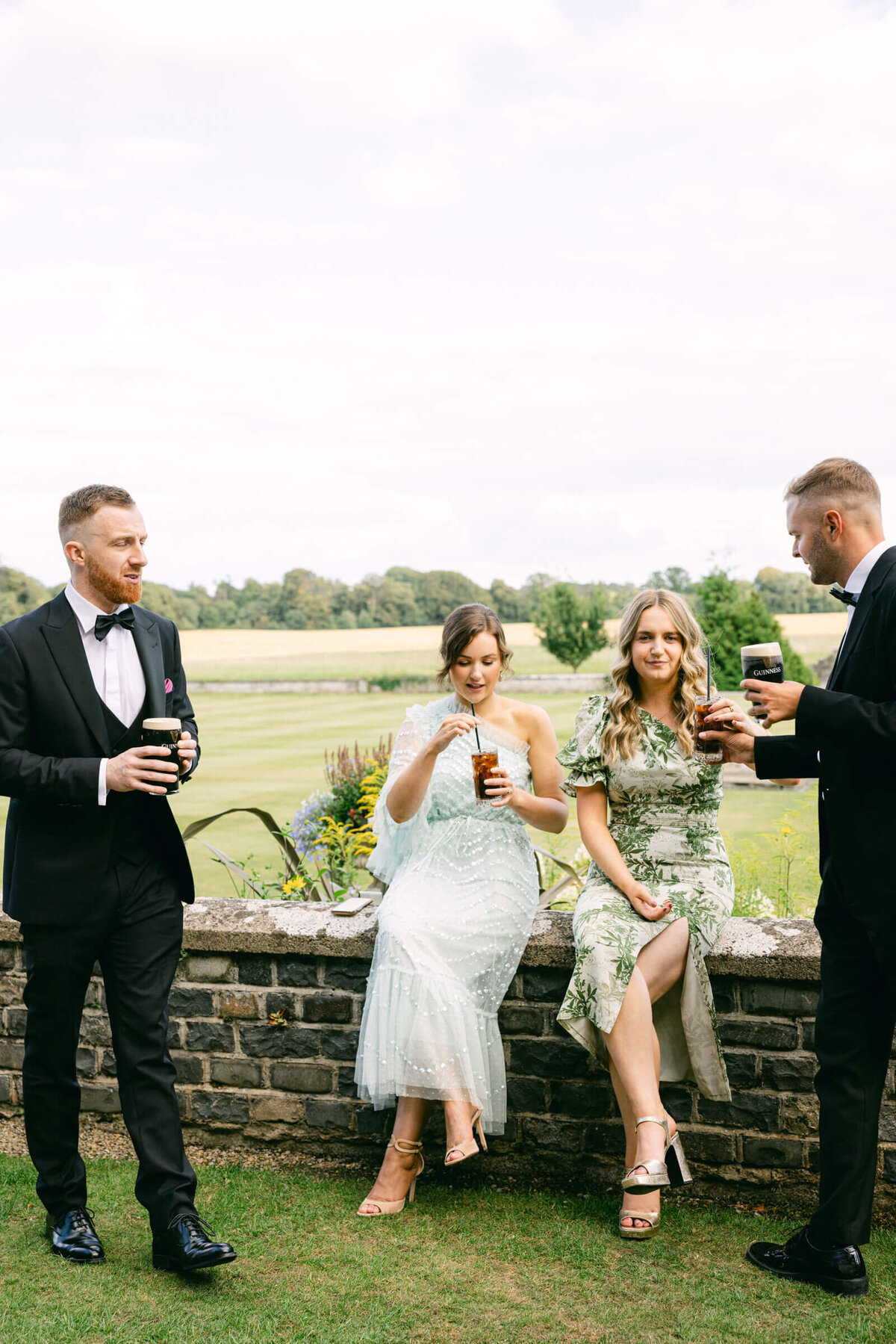 A candid wedding photo of guests during cocktail hour at a wedding at Luttrellstown Castle