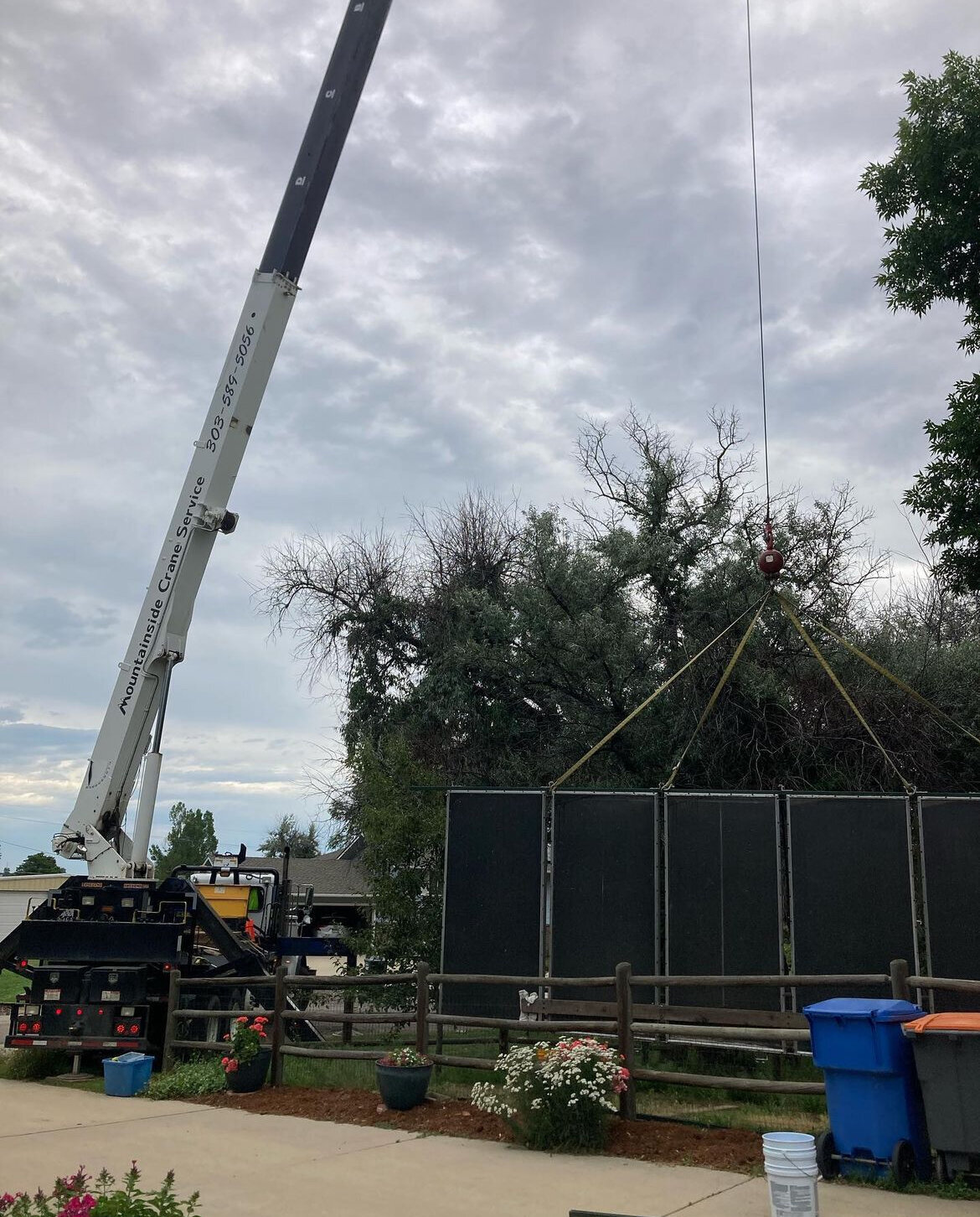 Solar panel lifting and transporting by Mountainside Crane Service for residential projects in Denver Metro and Colorado Foothills