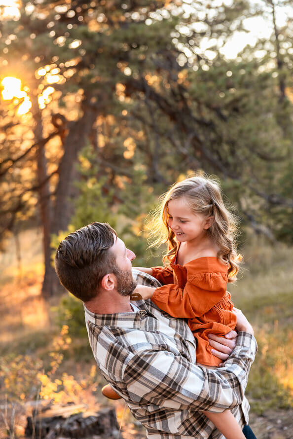 A dad plays with his young daughter out at Mr. Falcon Park.