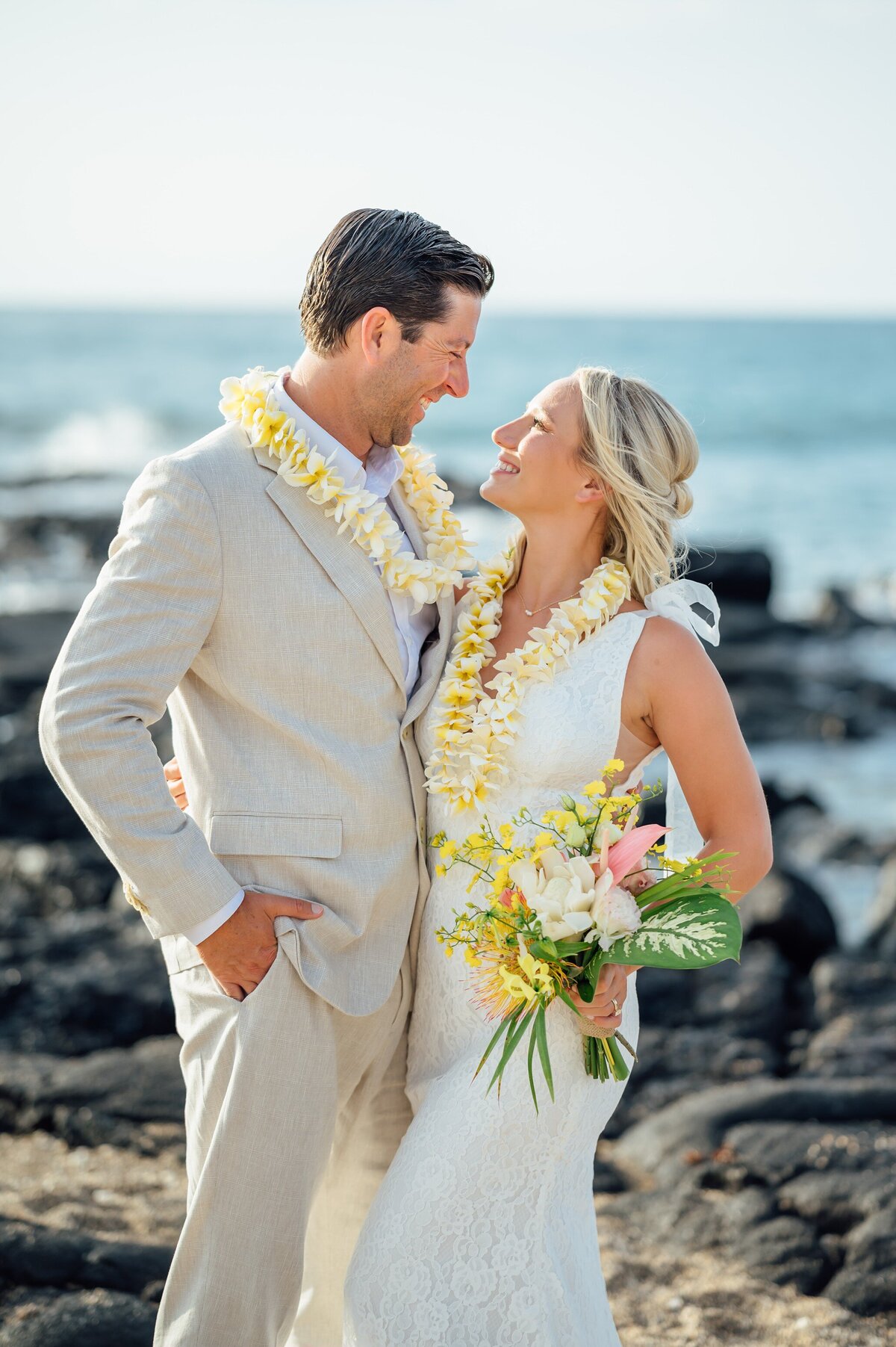 a joyful moment shared by newlyweds after their elopement in Hawaii