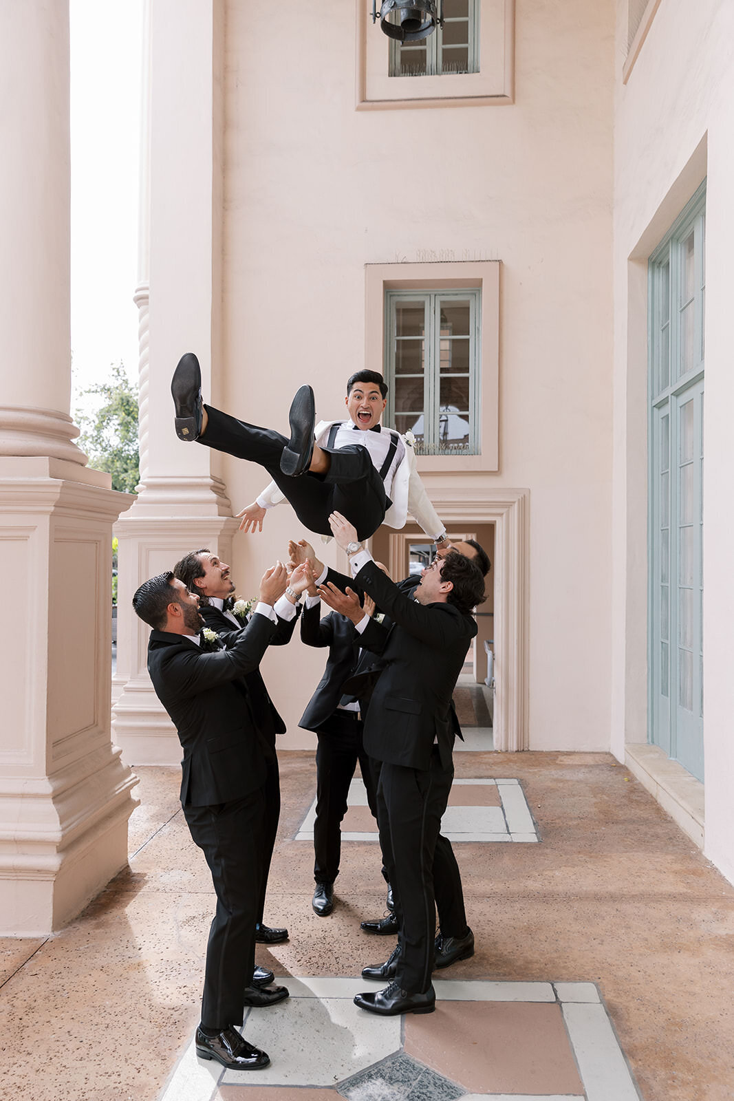 groomsmen-tossing-groom-2SA-W