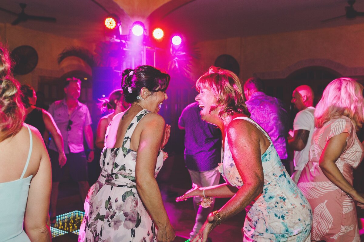 Guests dancing and laughing at wedding in Riviera Maya