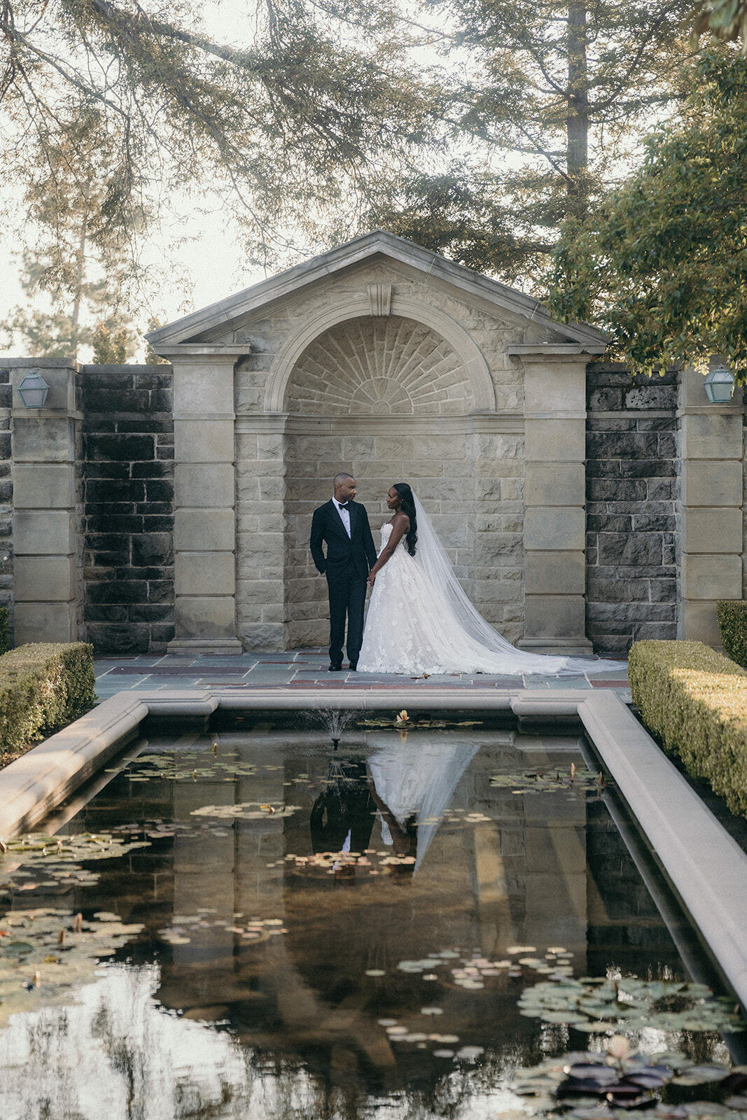 Wedding session at a pond in the garden of Greystone Mansion, L.A.