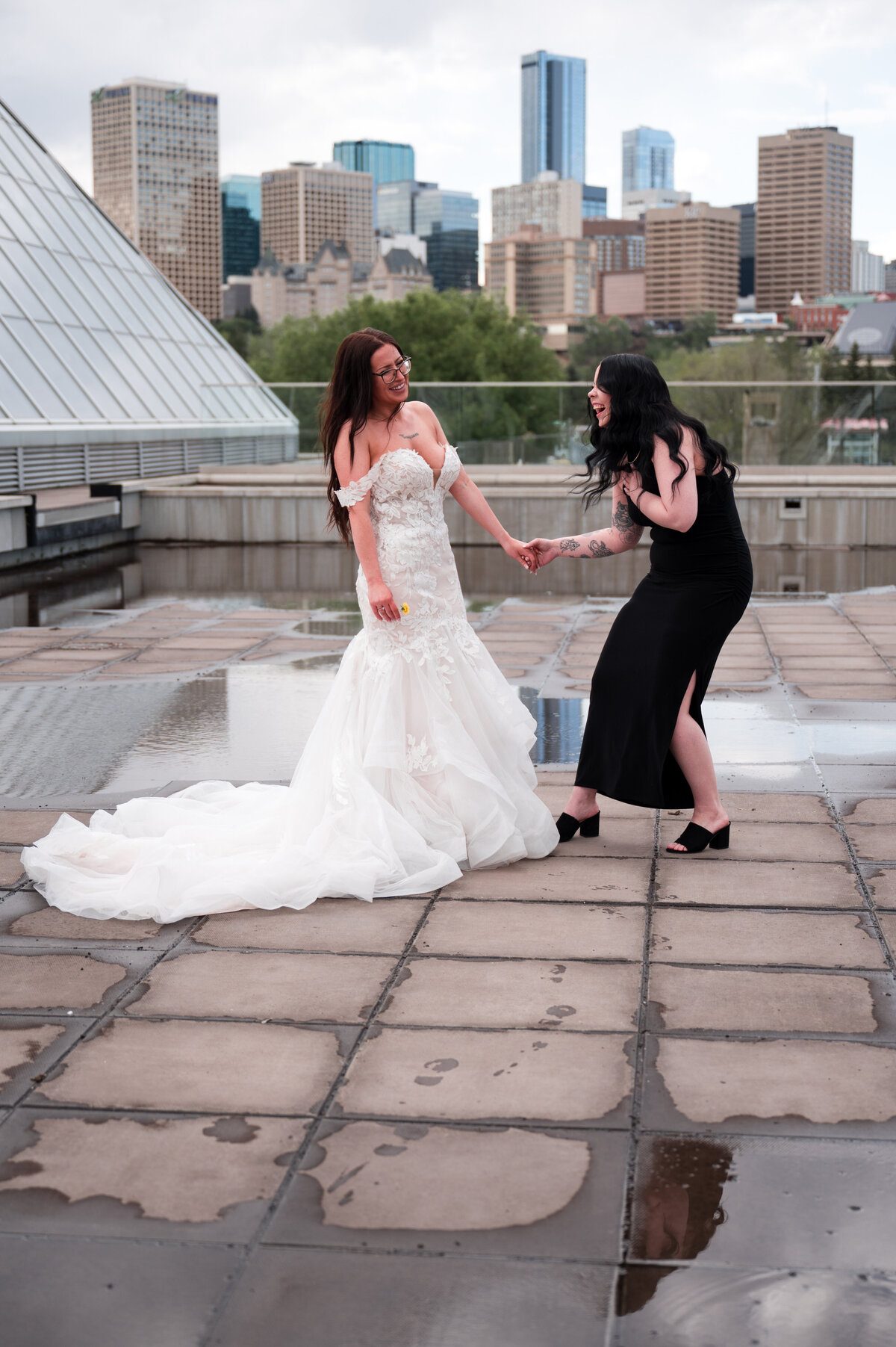 Bride and bridesmaid laughing