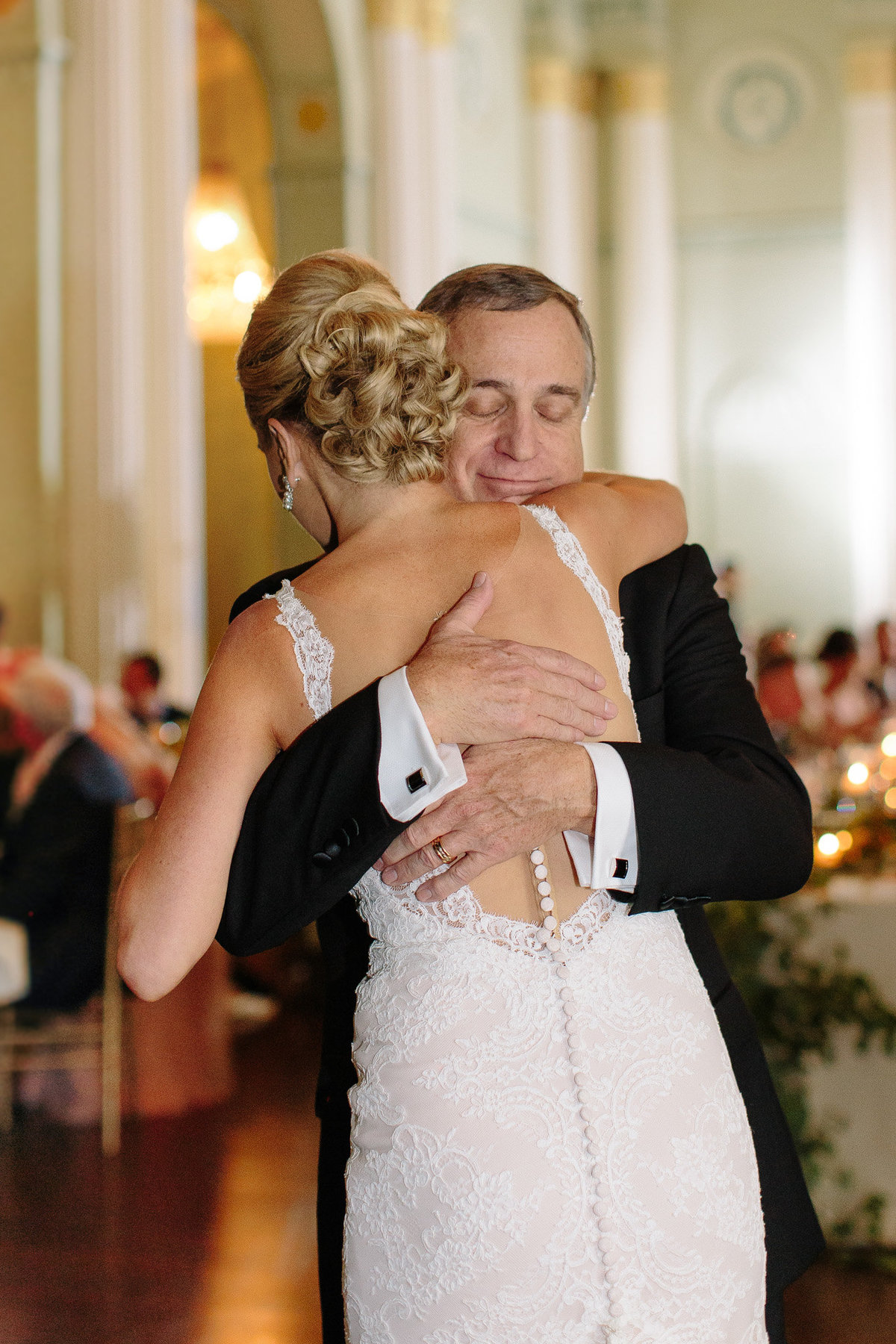An emotional real moment during the father daughter dance.  Photo by top Atlanta wedding photographer Rebecca Cerasani.
