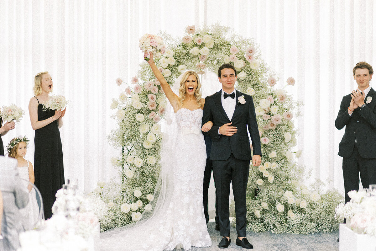 Wedding Photographer, bride and groom turning to walk down the aisle after ceremony